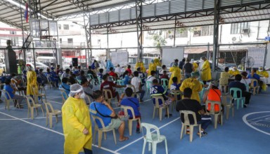 Resident wait Residents wait for their turn during a mass testing for COVID-19 in Manila