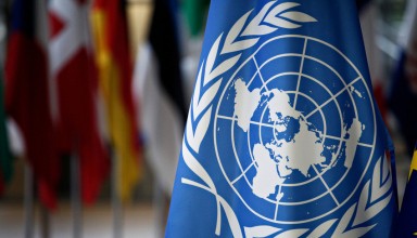 Flags of UN and EU stand in European council Building