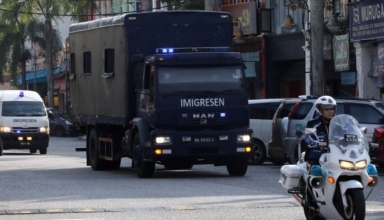 an immigration truck carrying myanmar migrants to be deported from malaysia is seen in lumut