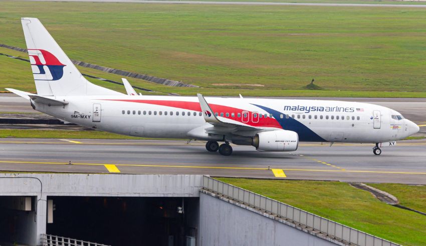 malaysian airlines passenger arrested in sydney after mid air incident