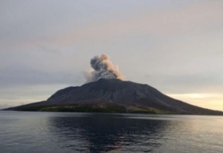 mount ruang erupts and the volcanic ash spreads over the three districts